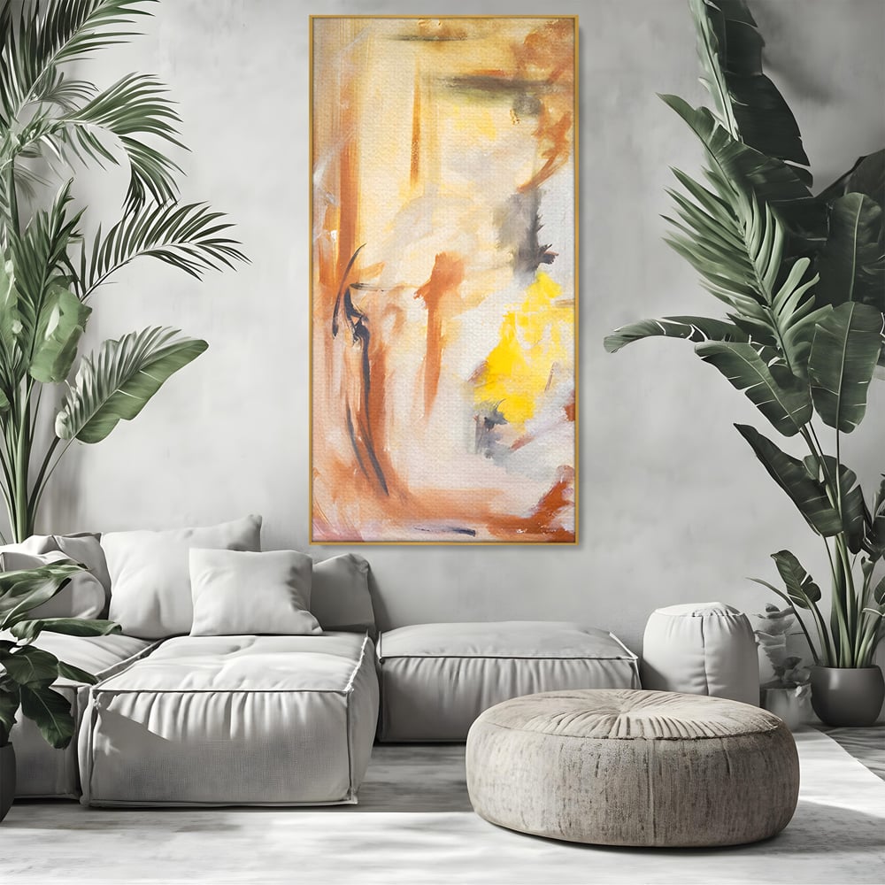 Tablou canvas cu pictura abstracta cu pete aurii si maronii, in rama de aluminiu auriu, pe perete intr-un living